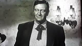 The man who shot liberty valance/jimmy Stewart/john wayne/woody strode(Wayne stands up to valance)