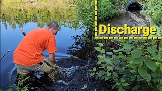 Draining Flooded Road By Unclogging Large Polyethylene Black Plastic Pipe, Releasing Big Gush