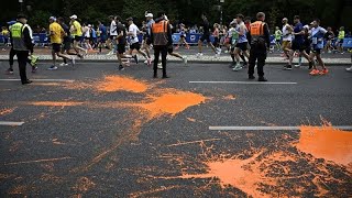 Ativistas ambientais em ação na Maratona de Berlim