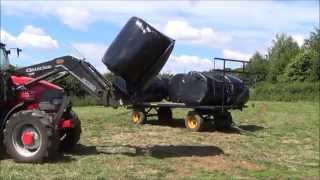 unloading silage bales