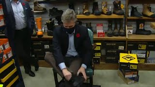 Ontario's finance minister takes part in tradition of buying new shoes for budget day