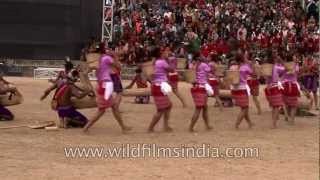 Garo tribal men playing drums while women dance to the beat!