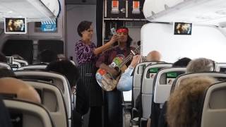 Jayden TJ sings with Megan Alatini onboard flight NZ672 DUD-AKL after a heavy turbulence