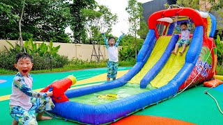 Yejun has good time at playground with kids water slides