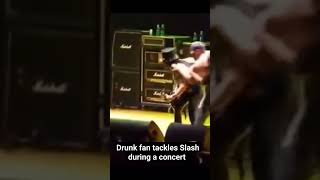 Drunk moron tackles Slash during a concert #music #gunsnroses #shorts