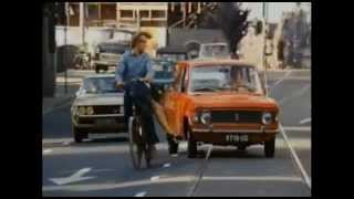 Riding it Dutch Style on a Dutch bike with a girl on the rear rack.