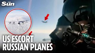Moment Russian pilots film US fighter jets escorting them over Alaskan air space