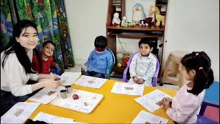 Saplings Preschool students involved in a Science experiment, Smell & Tell  ! Fun way of learning