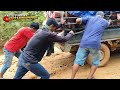 truck driver struggling on slippery hill baling hill