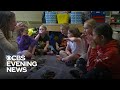 Students learning sign language to support a classmate