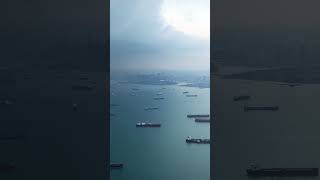 Flying into Singapore Harbor. I couldn't believe all the cargo ships. #singapore #asia #travel