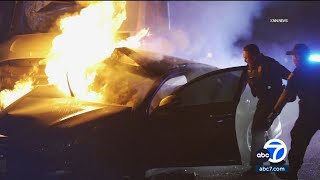 Police pull people from burning car after 710 Fwy crash in Long Beach