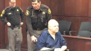 Thomas Clock III, empty-urn funeral director, wheeled into court