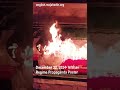 regime propaganda billboard burning in isfahan iran protests