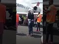 Watch as RIA airport workers lie under an Africa World Airlines plane holding it hostage in Liberia