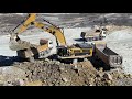 caterpillar 390d excavator loading mercedes arocs 4142 and actros trucks pyramis sa