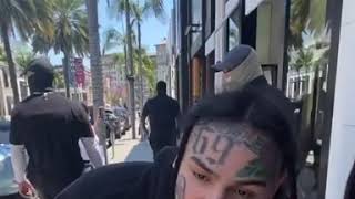 6ix9ine throws money at haters in Beverly Hills Rodeo Drive