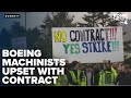 Boeing machinists rally against new contract, threaten strike if terms not met