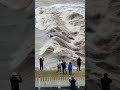 the tide rolled like a dragon. 杭州 钱塘江大潮 beach