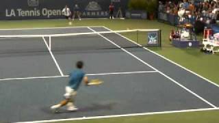Michael Chang gets crossed by Jim Courier at net