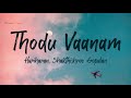 Thodu Vaanam Lyrics -  Anegan | Harish Jayaraj | Hariharan | Shakthishree Gopalan