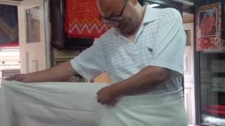 How to apply a Newar red-and-white shawl to accompany Haku Patasi