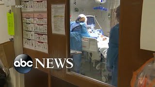 Virus surge overwhelms hospitals across the country