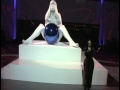 Lady Gaga wears a black futuristic suit with exceptionally tall stilettos and weird