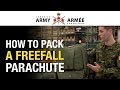 Learn how parachute riggers pack a Freefall Parachute