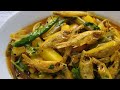 mourola machh er chorchori peyajkoli diye small mourala fish with onion stalks recipe