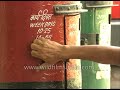 indian postman empties a letter box archival footage of the daakiya