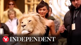 Kylie Jenner wears huge realistic lion head at Paris Fashion Week