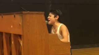 Kid performs Bohemian Rhapsody in front of whole school!