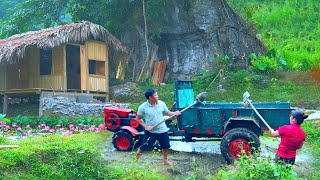 Transports building materials by tractor to facilitate farm construction - Concrete frame erection