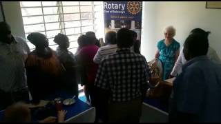 Rotarians congratulating their newly inducted members