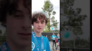 Wyatt Oleff giving support to young AYA during Teen Cancer America's fundraiser walk.