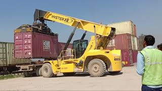 Rail Yard container loading on freight train and ready for departure