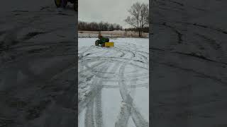 John Deere 314 in snow