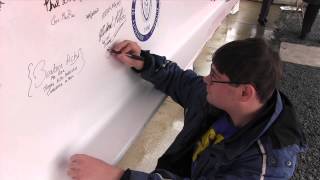Making Their Mark: UMass Boston Students Sign the Last Beam for GAB No. 1