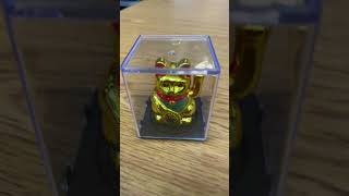 The Maneki - neko golden beckoning cat