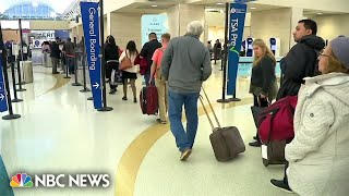 Thousands stuck at airports amid flight delays and cancellations