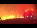 crews battle wind whipped california brushfire time