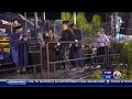 FIU graduate student paralyzed in diving accident walks across the stage