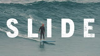 Slide - Surfing big waves at Bronte Beach