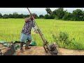 pumping water out of the flooded rice field បូមទឹកចេញពីស្រែដែលលិចលង់