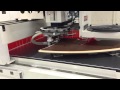 Vector Revolution Contour Edgebander applying banding on shark nose undercut panel