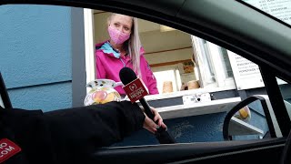 Coffee shop worker stunned and speechless when Secret Santa gifts her a car and cash