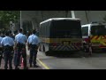 hk activist charged with secession transported in police vehicle from court afp