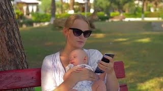 Woman With Baby Outdoors Stock Video
