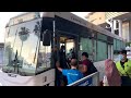 Travellers board a Causeway Link bus at the bus concourse in Woodlands Checkpoint on April 1, 2022